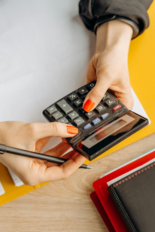 calculator and hands image